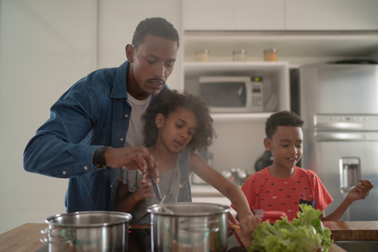 Family Cooking Together at Kitchen